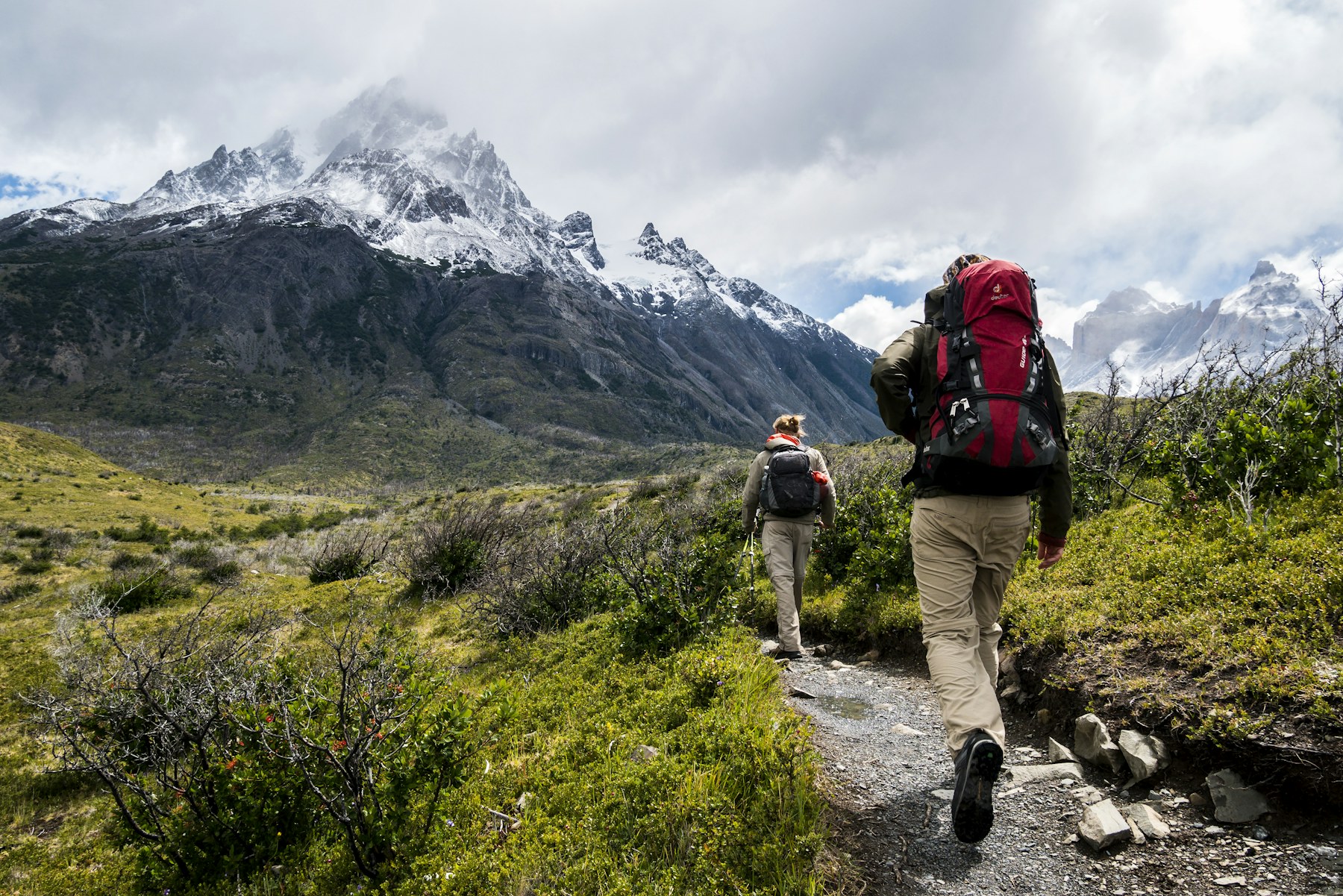 Hikers walking through a mountain landscape